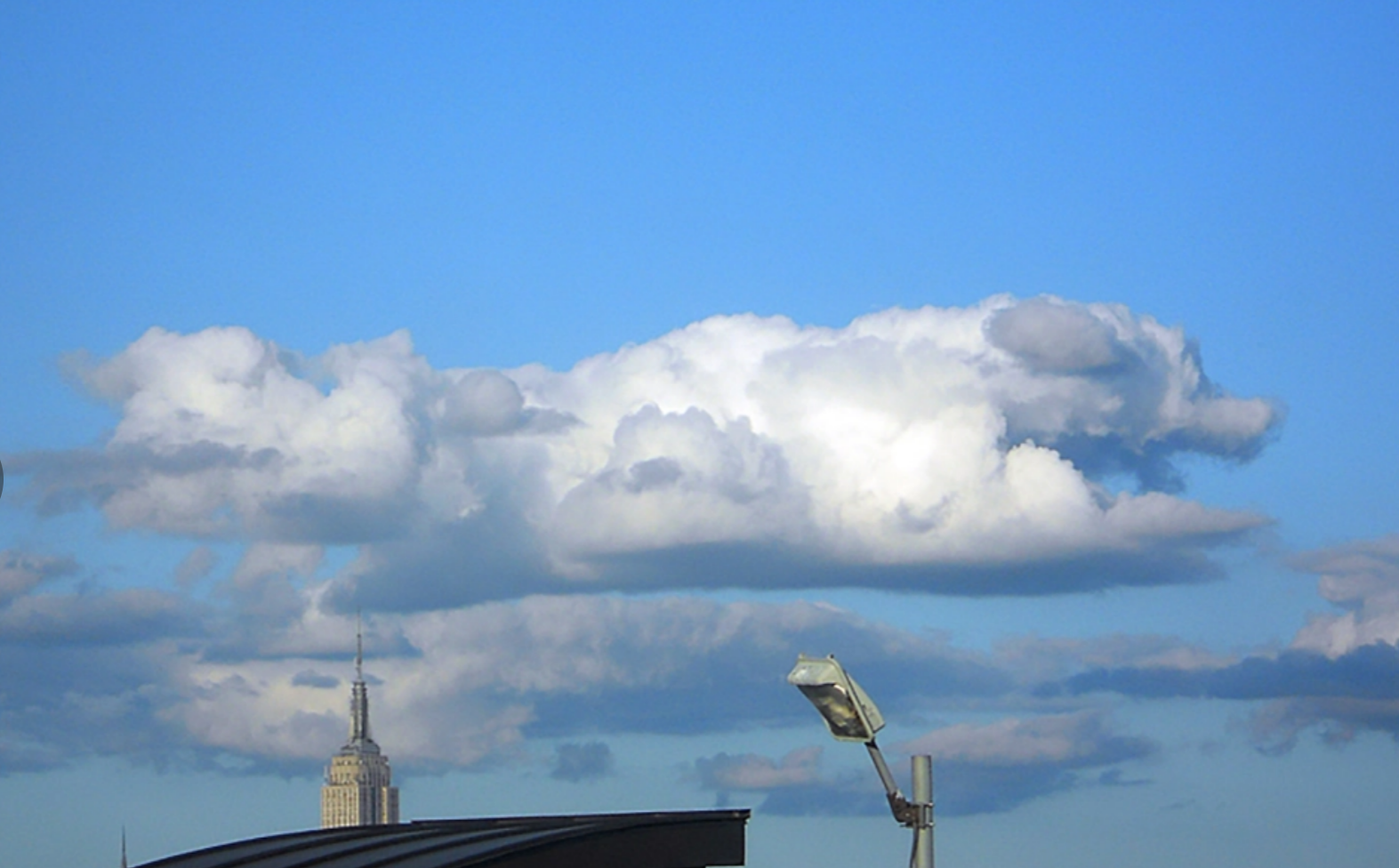 Clouds that resemble shapes - this author sees a running dog